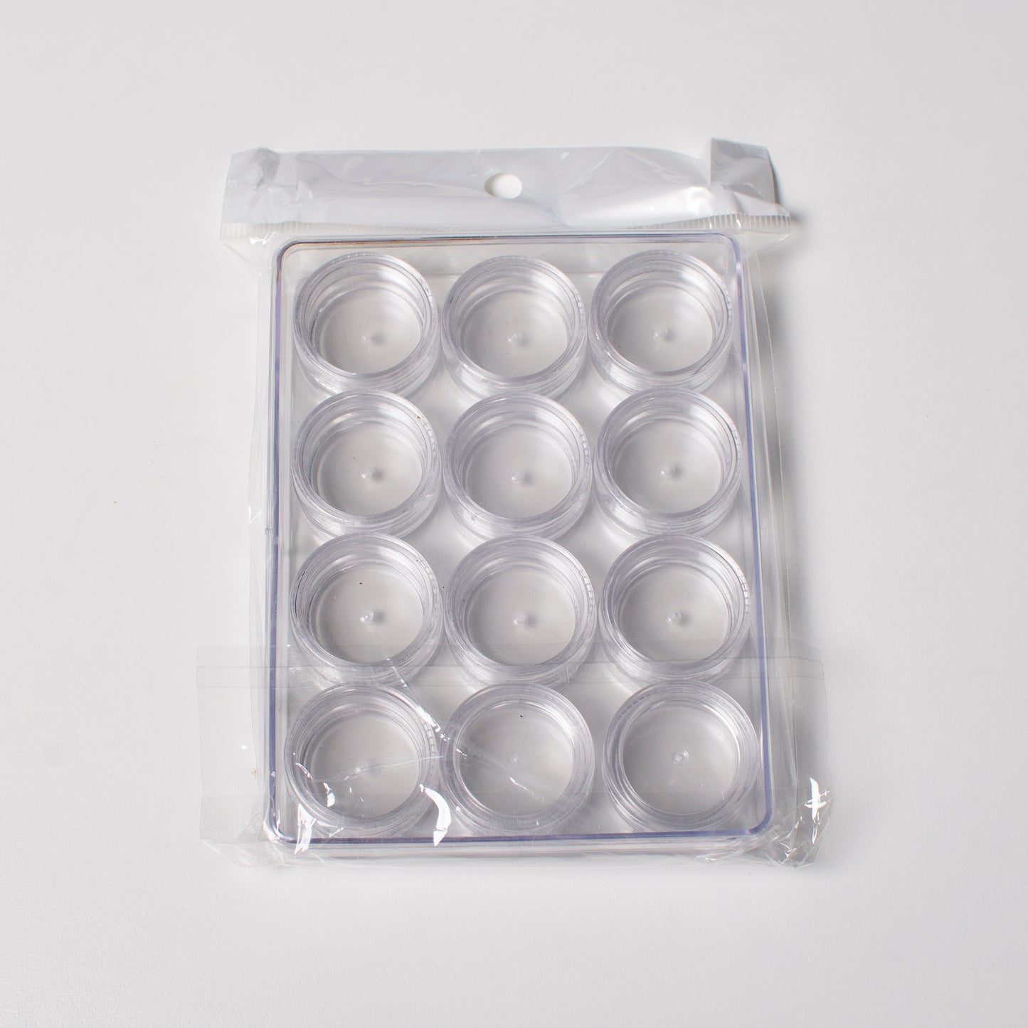 Plastic box with round screw-top jars - 12pcs., 19.5x9.5x2 cm