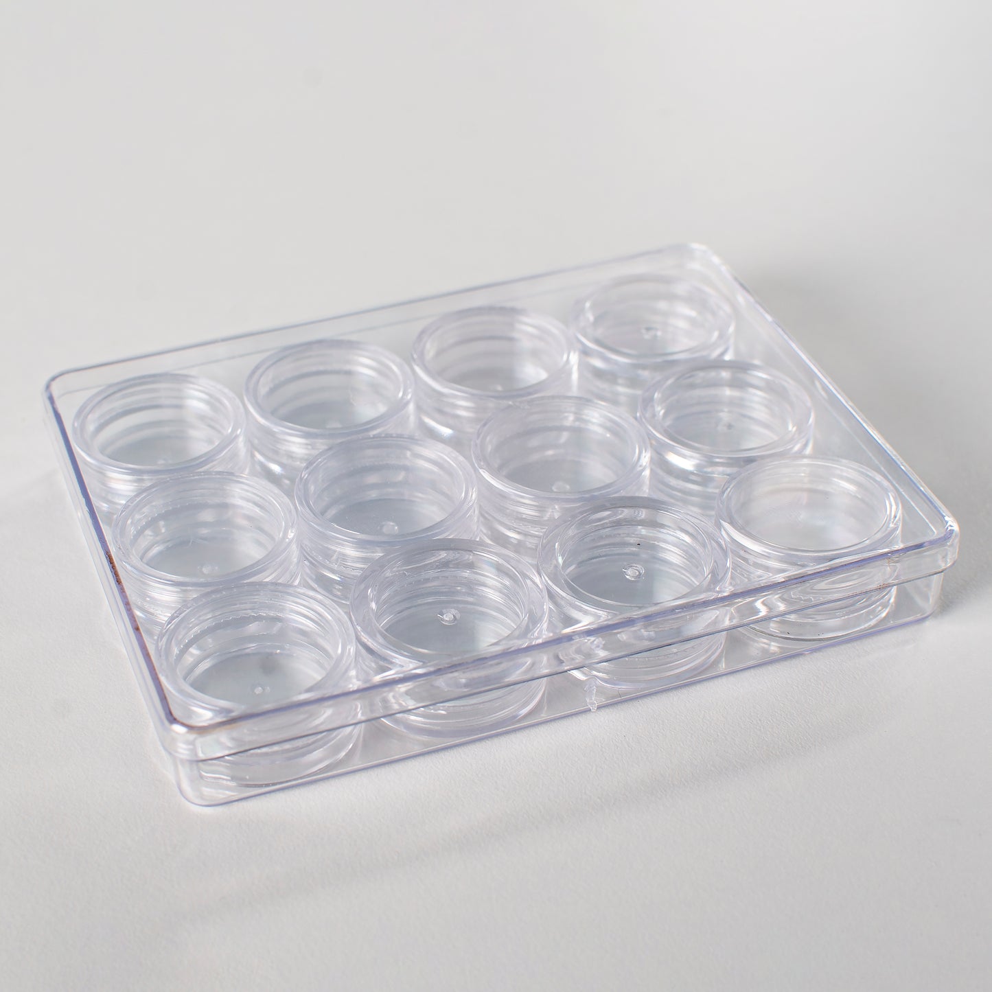 Plastic box with round screw-top jars - 12pcs., 19.5x9.5x2 cm